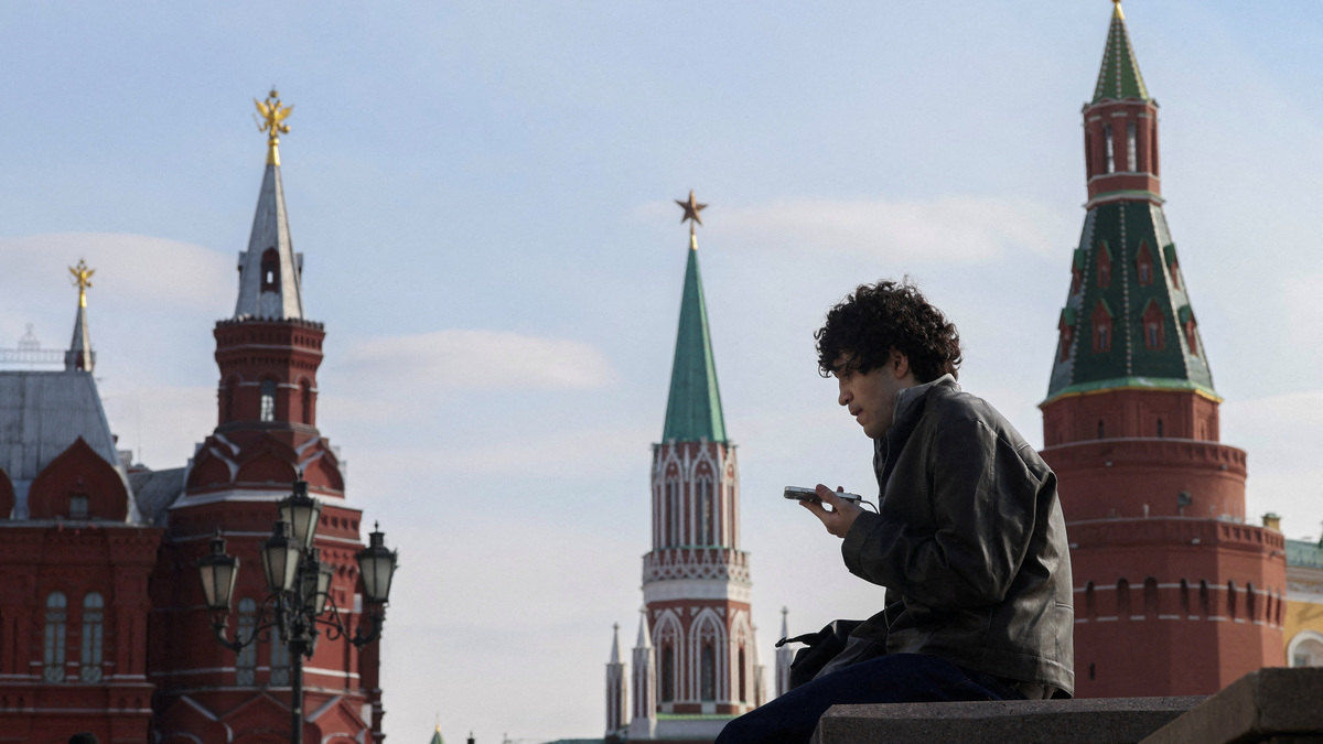 A man checks his mobile phone on March 17 in central Moscow, Russia.