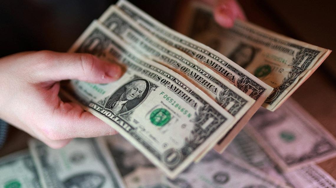 Dollar firms as oil climbs, bond rout saps risk appetite 
