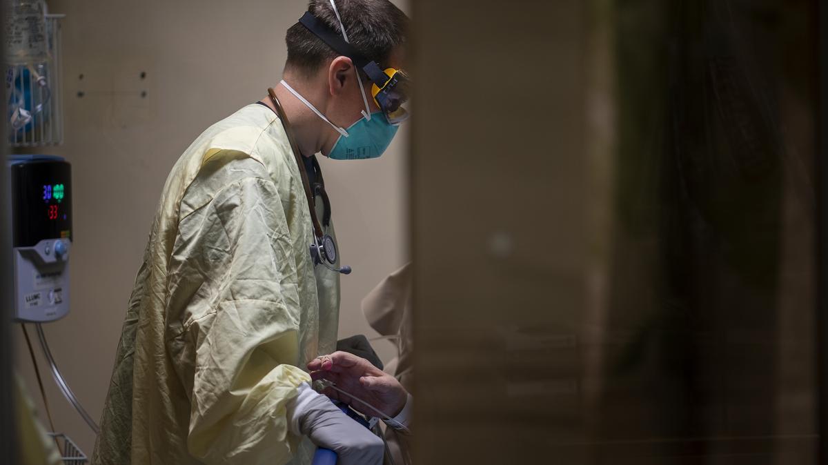 Dr. Seth Dukes treats a COVID-19 patient inside the emergency department at Loma Linda University Medical Center on Dec. 15, 2020, in Loma Linda, Calif. (Gina Ferazzi/Los Angeles Times/TNS)