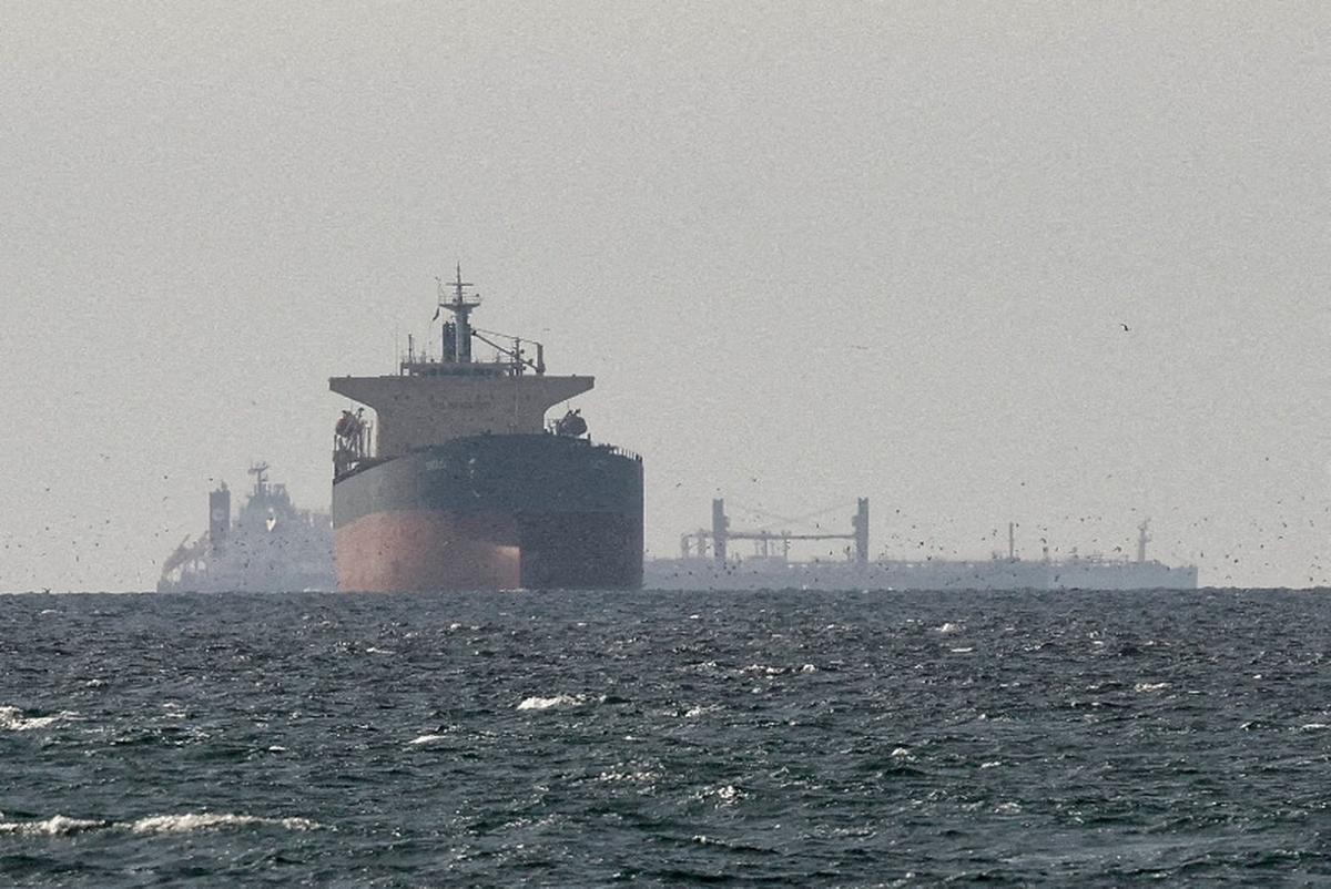 FILE PHOTO: Cargo ships in the Gulf, near the Strait of Hormuz, as seen from northern Ras al-Khaimah, near the border with Oman’s Musandam governance, amid the U.S.-Israeli conflict with Iran, in United Arab Emirates, March 11, 2026./File Photo