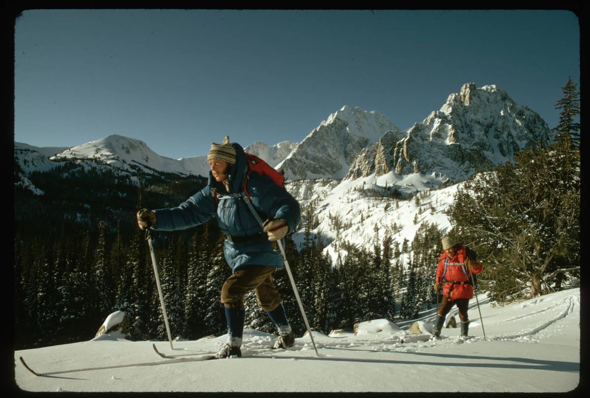  Two skiers telemark near Castle Peak in the White Cloud Mountains of Idaho (1972).