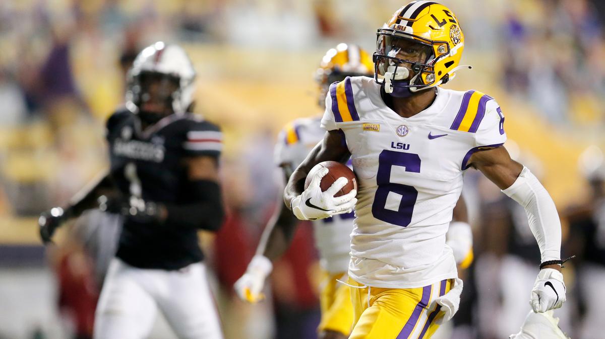 FILE - In this Saturday, Oct. 24, 2020 file photo, LSU wide receiver Terrace Marshall Jr. (6) runs the ball for a touchdown against South Carolina during the first half of an NCAA college football game in Baton Rouge, La. Baltimore ranked last in the NFL averaging 171.2 yards passing per game and had the fewest pass attempts with 406 last season. That’s partly because the running game was so proficient behind quarterback Lamar Jackson, the catalyst for the league’s No. 1 rushing attack (191.9 yards per game) for the second straight season.(AP Photo/Brett Duke, File)