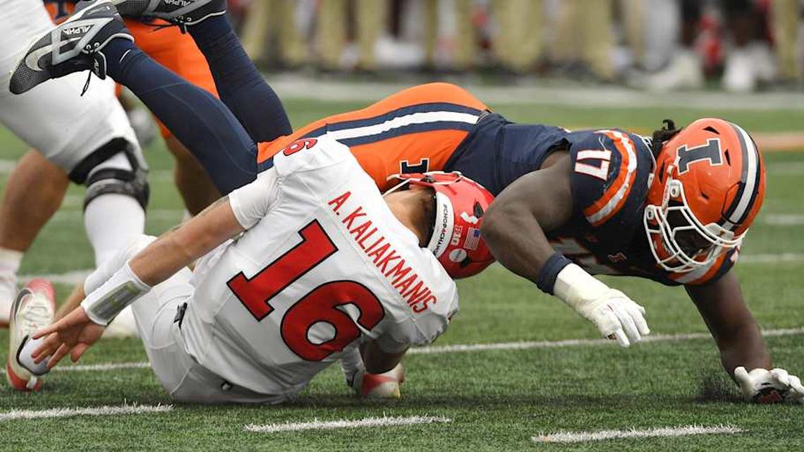  Nov 1, 2025; Champaign, Illinois, USA; Illinois Fighting Illini linebacker Gabe Jacas (17) sacks Rutgers Scarlet Knights quarterback Athan Kaliakmanis (16) during the first half at Memorial Stadium. Mandatory Credit: Ron Johnson-Imagn Images | Ron Johnson-Imagn Images 
