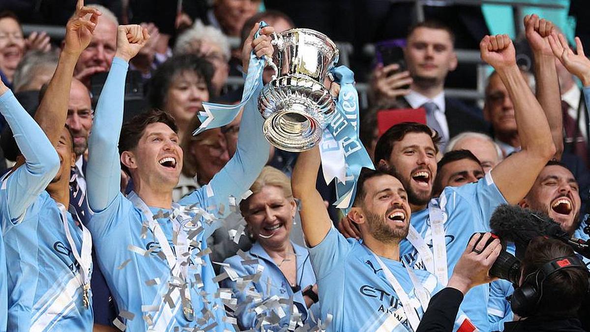  Two City stalwarts step out for the final time. | Adrian Dennis/AFP/Getty Images 