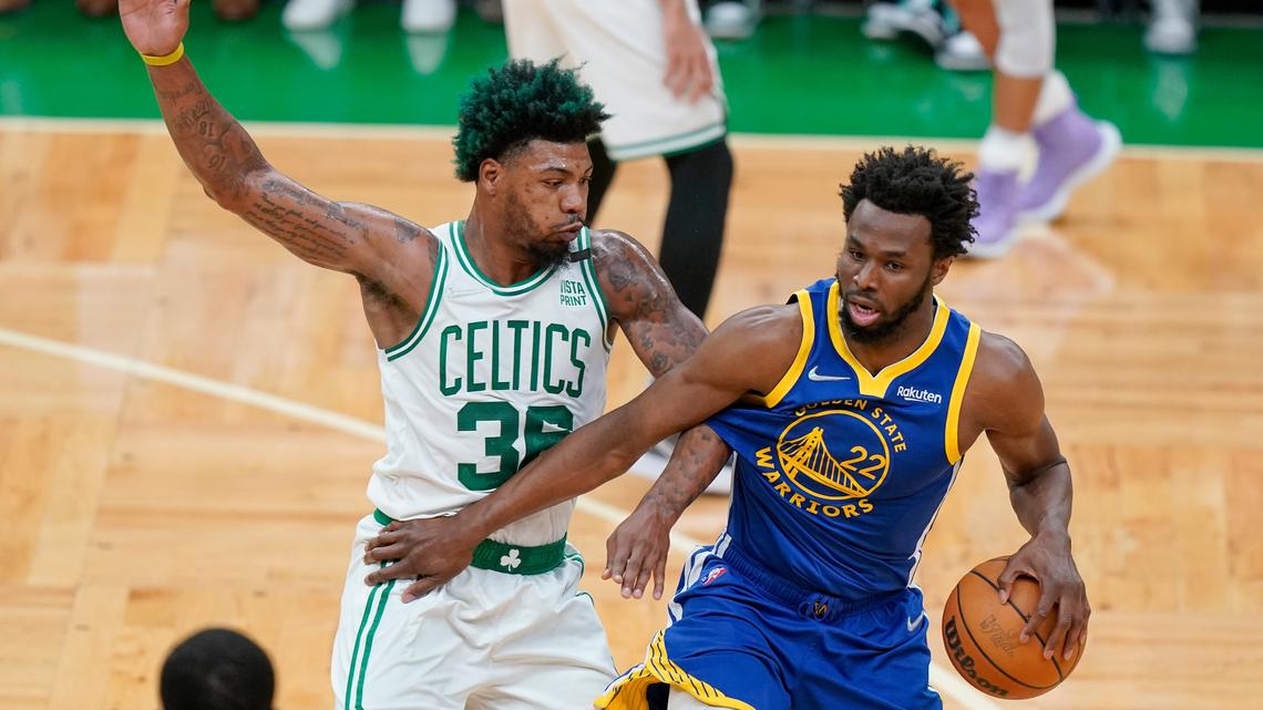 Golden State Warriors forward Andrew Wiggins (22) drives against Boston Celtics guard Marcus Smart (36) during the first quarter of Game 6 of basketball’s NBA Finals, Thursday, June 16, 2022, in Boston. (AP Photo/Steven Senne)