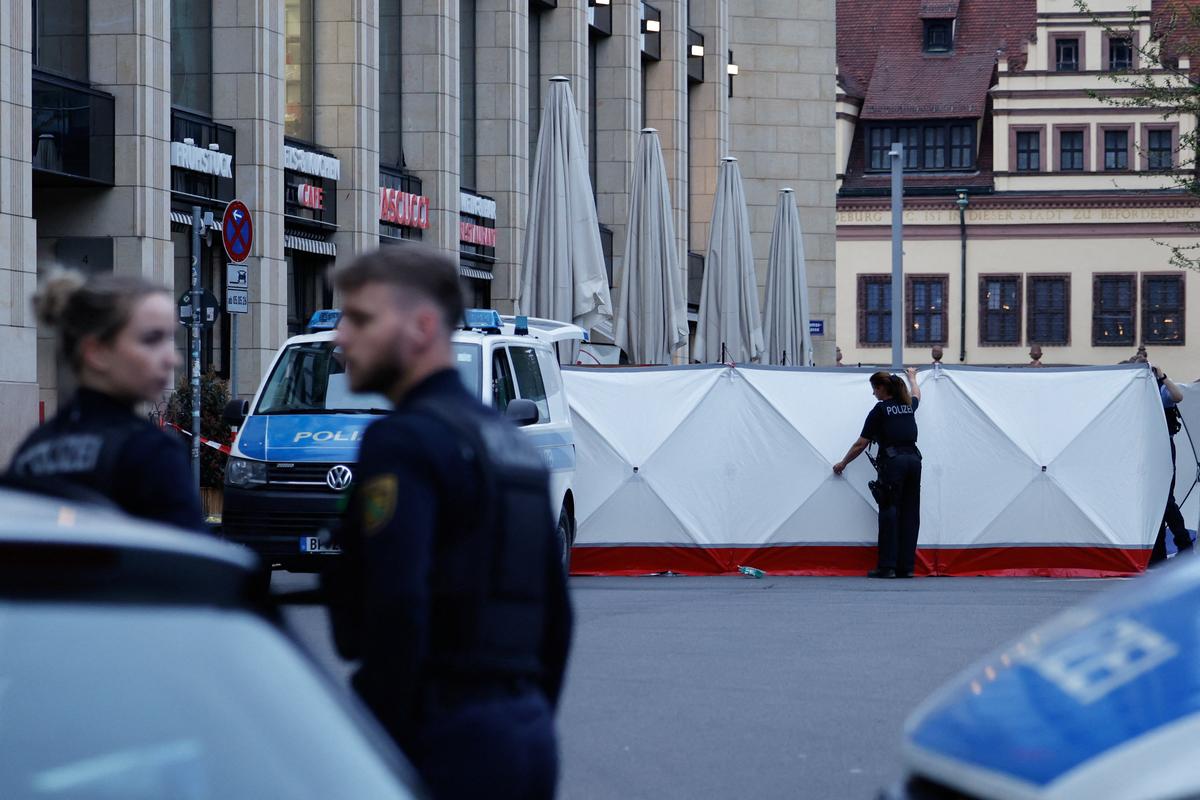 Police officers work at a site where a car drove into a group of people, in Leipzig, Germany, May 4, 2026.  REUTERS/Axel Schmidt