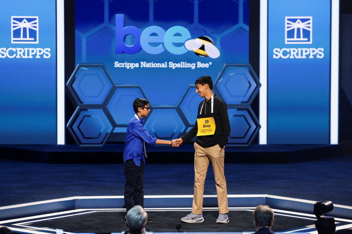 Shrey Parikh shakes hands with Ishaan Gupta after Parikh won the annual Scripps National Spelling Bee, in Washington, D.C., U.S., May 28, 2026. REUTERS/Evelyn Hockstein