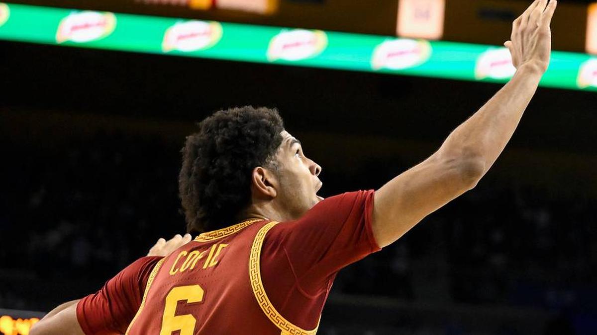  Feb 24, 2026; Los Angeles, California, USA; UCLA Bruins forward Tyler Bilodeau (34) shoots over Southern California Trojans forward Jacob Cofie (6) during the second half at Pauley Pavilion presented by Wescom Financial. Mandatory Credit: Robert Hanashiro-Imagn Images | Robert Hanashiro-Imagn Images 