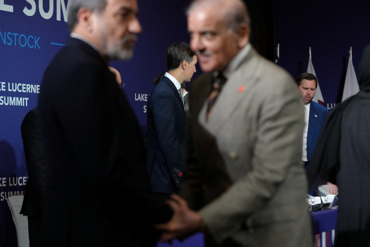 U.S. Vice President JD Vance looks on next to U.S. President Donald Trump's son-in-law Jared Kushner, as Iran's Foreign Minister Abbas Araqchi shakes hands with Pakistan's Prime Minister Shehbaz Sharif, before the start of a quadrilateral meeting between the U.S., Iran, Pakistan, and Qatar at the Lake Lucerne Summit, aimed at advancing a deal to end the Middle East conflict, at Buergenstock Resort Lake Lucerne, near Stansstad, Switzerland, June 21, 2026. REUTERS/Nathan Howard/Pool