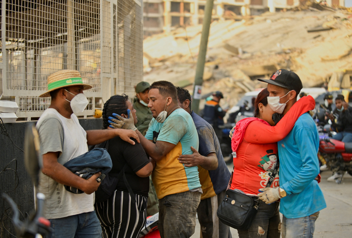 People react, as rescue operations continue after earthquakes hit the country, in La Guaira, Venezuela, June 27, 2026. REUTERS/Maxwell Briceno