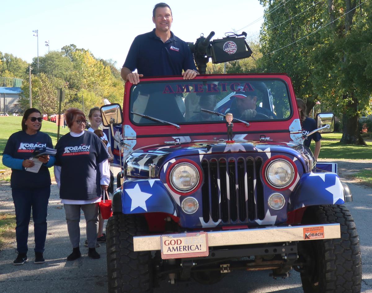 In this photo from 2018, Kris Kobach, then the Kansas secretary of state and the Republican nominee for Kansas governor, rides in a parade in a jeep with a replica machine gun in Baldwin City. The jeep was the signature prop in Kobach’s campaign for governor that year, which he lost to Democrat Laura Kelly.