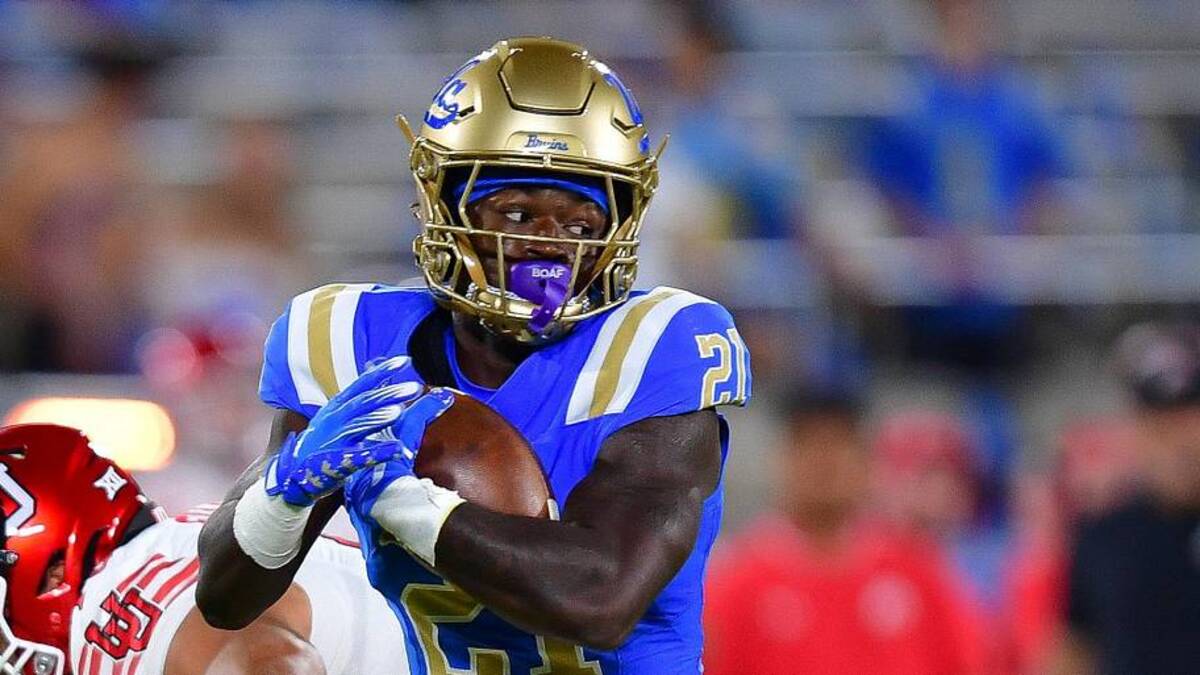  Aug 30, 2025; Pasadena, California, USA; UCLA Bruins defensive back Cole Martin (21) is brought down by Utah Utes cornerback Jason Stokes Jr. (13) during the second half at Rose Bowl. Mandatory Credit: Gary A. Vasquez-Imagn Images | Gary A. Vasquez-Imagn Images 