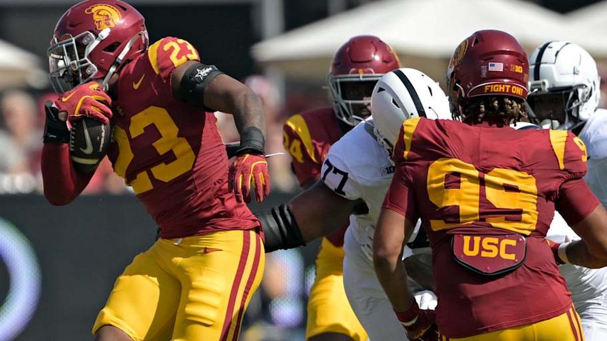  Oct 12, 2024; Los Angeles, California, USA; USC Trojans linebacker Desman Stephens II (23) runs the ball after an interception in the first half against the Penn State Nittany Lions at United Airlines Field at the Los Angeles Memorial Coliseum. Mandatory Credit: Jayne Kamin-Oncea-Imagn Images | Jayne Kamin-Oncea-Imagn Images 