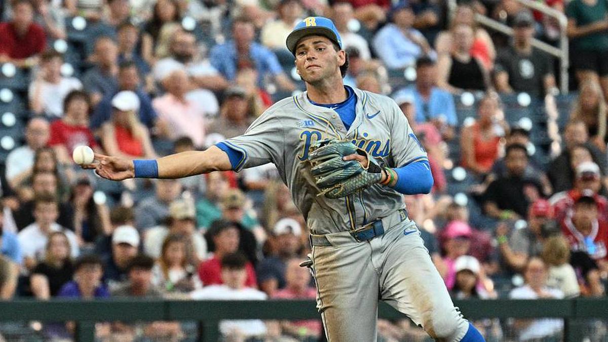  Jun 17, 2025; Omaha, Neb, USA; UCLA Bruins shortstop Roch Cholowsky (1) throws to first base against the Arkansas Razorbacks during the third inning at Charles Schwab Field. Mandatory Credit: Steven Branscombe-Imagn Images | Steven Branscombe-Imagn Images 