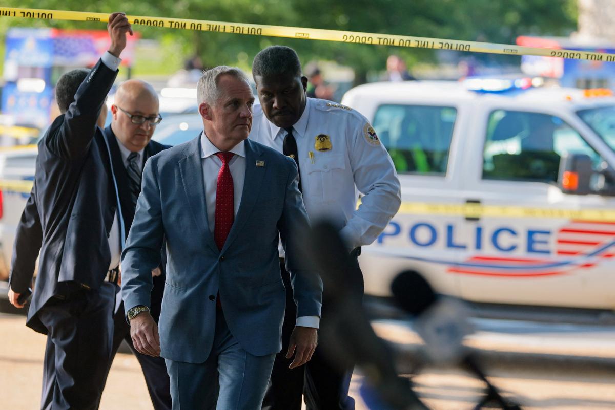Matthew Quinn, Deputy Director of U.S. Secret Service, walks to speak to the media at the scene of an officer-involved shooting in Washington, D.C., U.S., May 4, 2026. REUTERS/Jonathan Ernst