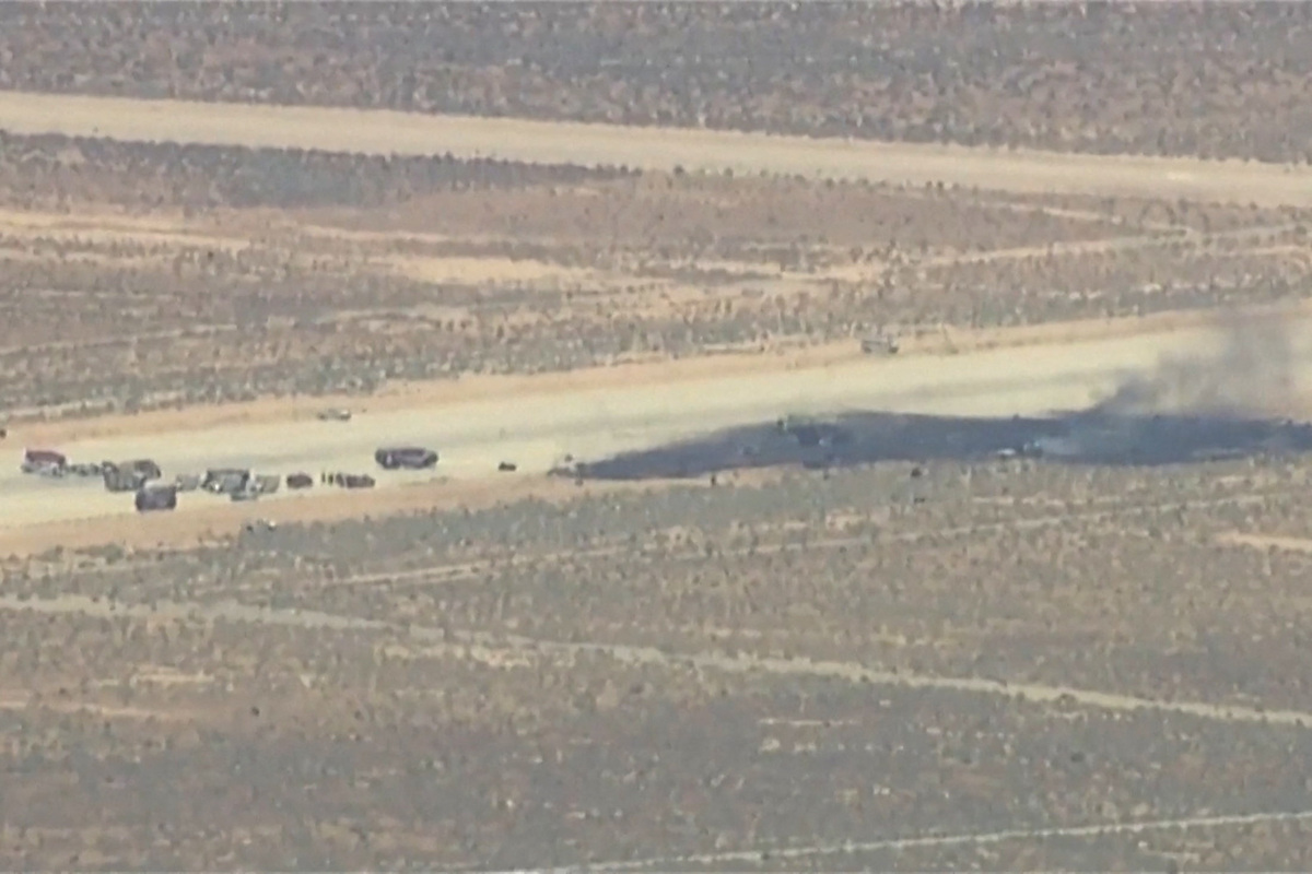Smoke rises from a blackened part of Edwards Air Force Base after the crash of a U.S. Air Force B-52 bomber aircraft in Edwards, California, U.S., June 15, 2026, in a still image from news helicopter video.  ABC Affiliate KABC via REUTERS
