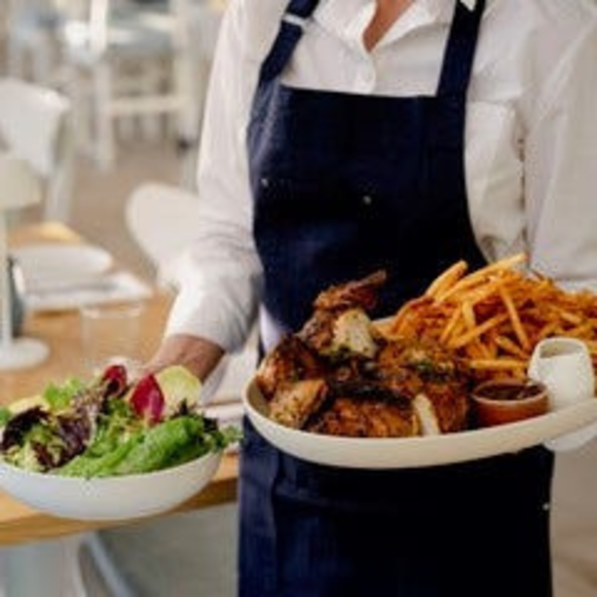 The Blue Door's Sunday family supper comprises roast chicken, beef-tallow fries and salad. The $89 deal feeds up to four people.