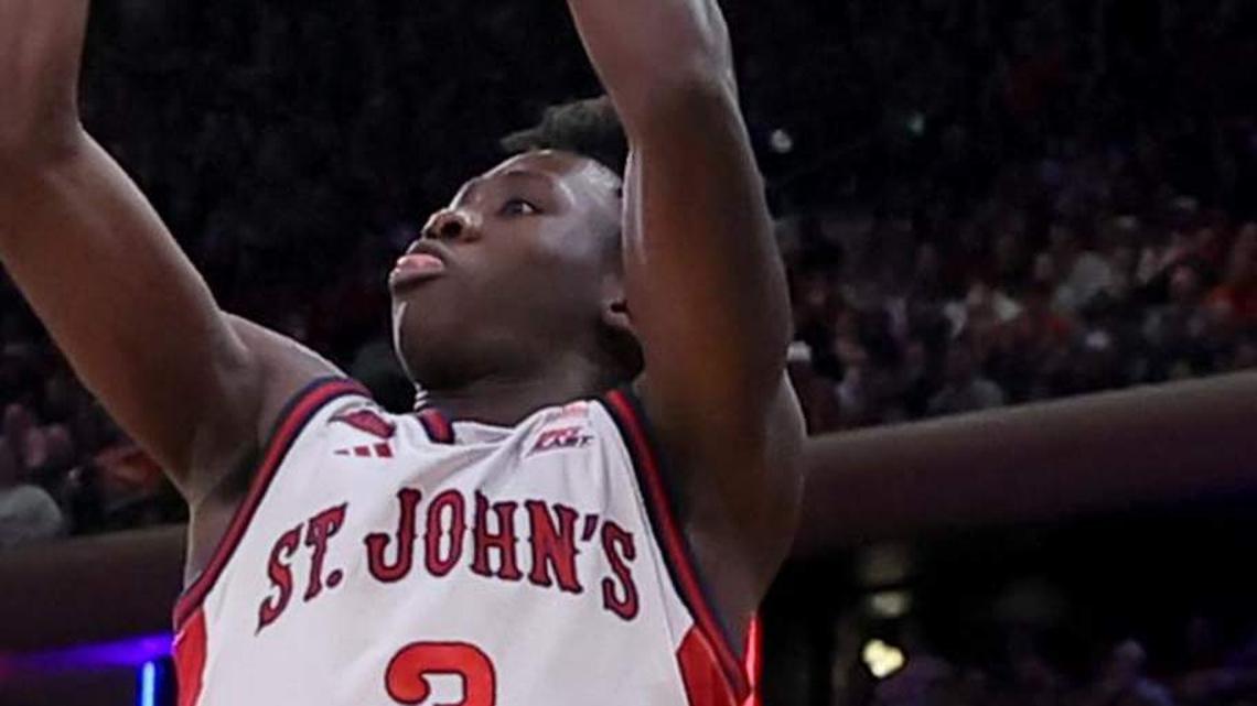  Mar 14, 2026; New York, NY, USA; St. John's Red Storm guard Joson Sanon (3) shoots a three point shot against Connecticut Huskies guard Braylon Mullins (24) during the second half of the men's Big East Conference Tournament Championship game at Madison Square Garden. Mandatory Credit: Brad Penner-Imagn Images | Brad Penner-Imagn Images 