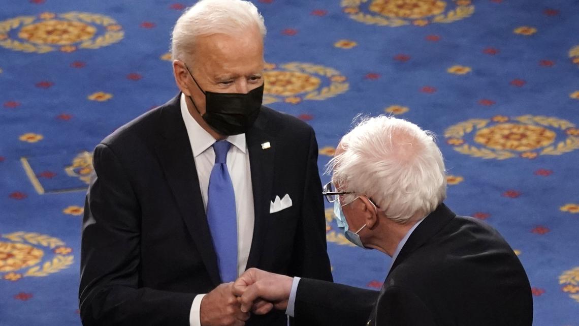 FILE - In this April 28, 2021 file photo, President Joe Biden greets Sen. Bernie Sanders, I-Vt., as Biden arrives to speak to a joint session of Congress in the House Chamber at the U.S. Capitol in Washington. (AP Photo/Andrew Harnik, Pool)