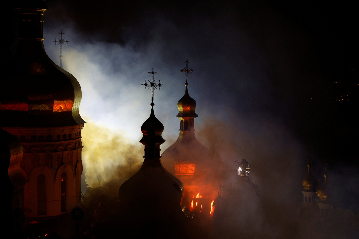 The Dormition Cathedral of the Kyiv Pechersk Lavra burns after it was hit during Russian missile and drone strikes, amid Russia's attack on Ukraine, in Kyiv, Ukraine June 15, 2026. REUTERS/Valentyn Ogirenko