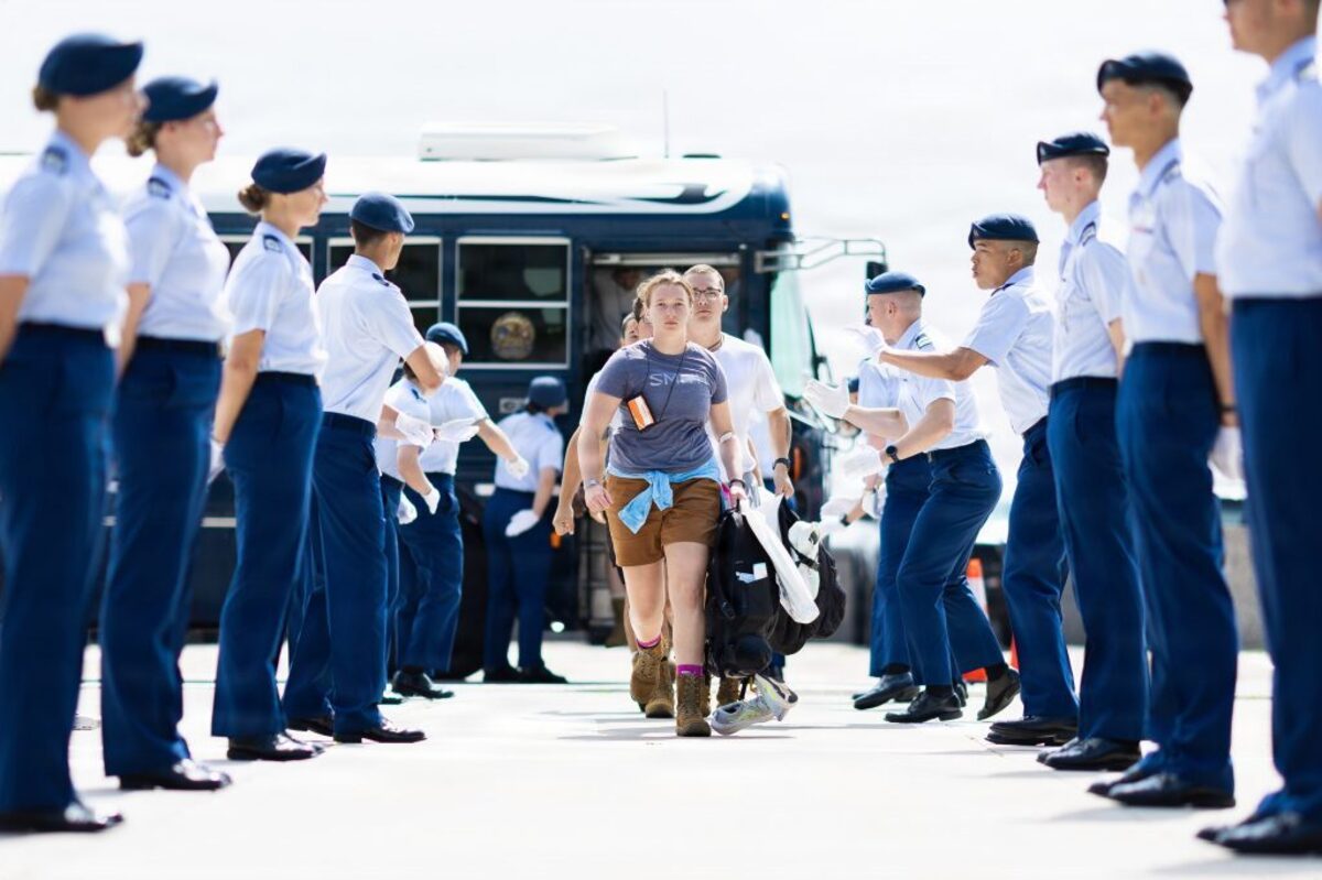  Basic cadets go through a gauntlet of cadre as they step off the bus. (US Air Force Academy via SWNS) 