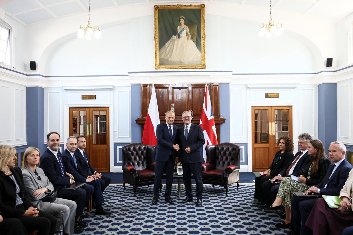 Britain's Prime Minister Keir Starmer and Poland's Prime Minister Donald Tusk attend a bilateral meeting as the countries formalise a UK-Poland security agreement, at RAF Northolt, near Uxbridge, Britain, May 27, 2026. REUTERS/Jack Taylor/Pool