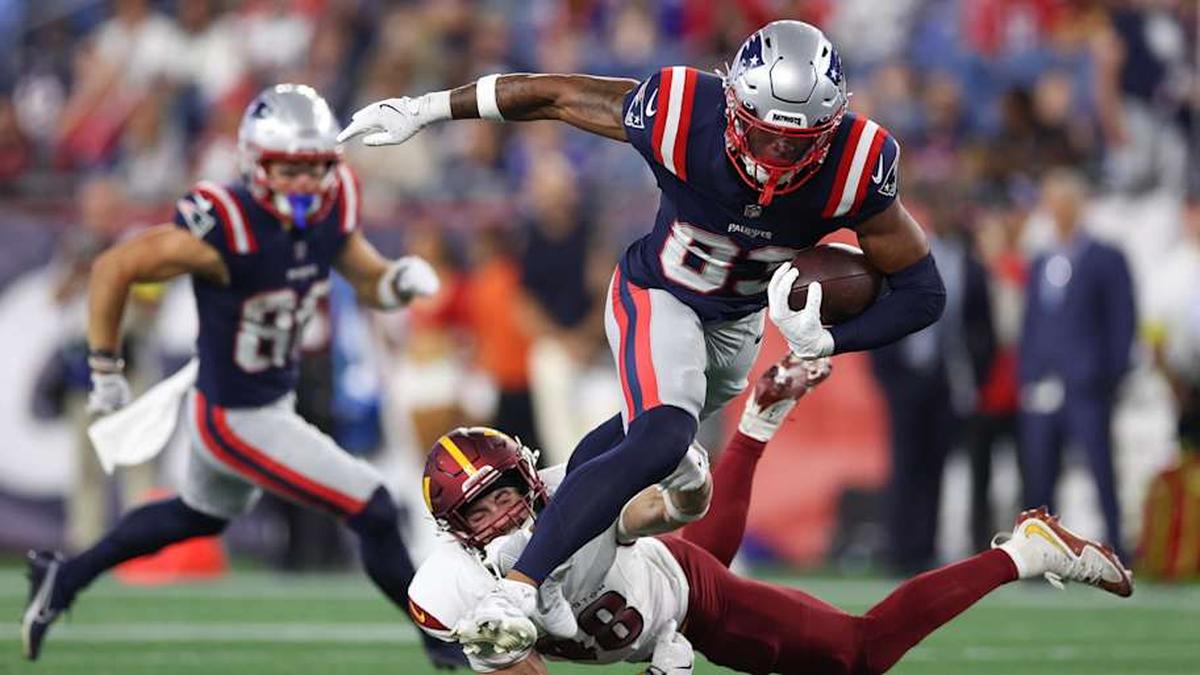  Aug 8, 2025; Foxborough, Massachusetts, USA; New England Patriots receiver John Jiles (83) breaks a tackle by Washington Commanders saftey Ben Nikkel (48) during the second half at Gillette Stadium. Mandatory Credit: Paul Rutherford-Imagn Images | Paul Rutherford-Imagn Images 
