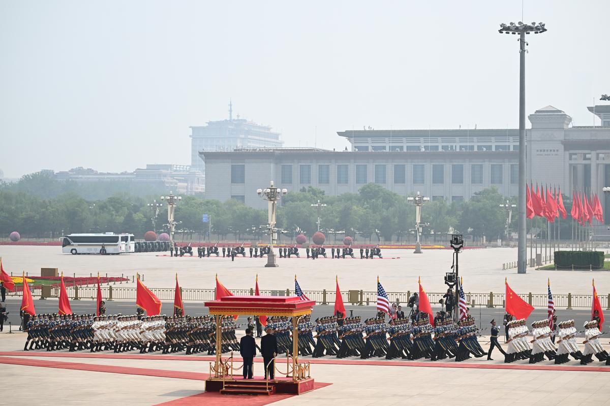 President Xi Jinping of China and President Donald Trump review a military parade outside the Great Hall of the People in Beijing during their two-day summit, on Thursday, May 14, 2026. During the first U.S. presidential visit to China in nearly a decade, Xi delivered a warning on Taiwan, saying that the issue, if handled poorly, could lead to conflict and "an extremely dangerous situation." (Kenny Holston/The New York Times)..