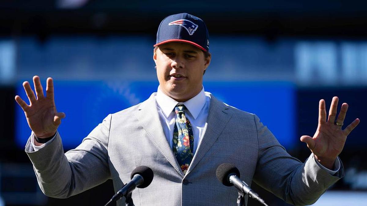  May 7, 2026; Foxborough, MA, USA; New England Patriots first round draft pick Caleb Lomu addresses the media during a press conference on the game field at Gillette Stadium. Mandatory Credit: Natalie Reid-Imagn Images | Natalie Reid-Imagn Images 