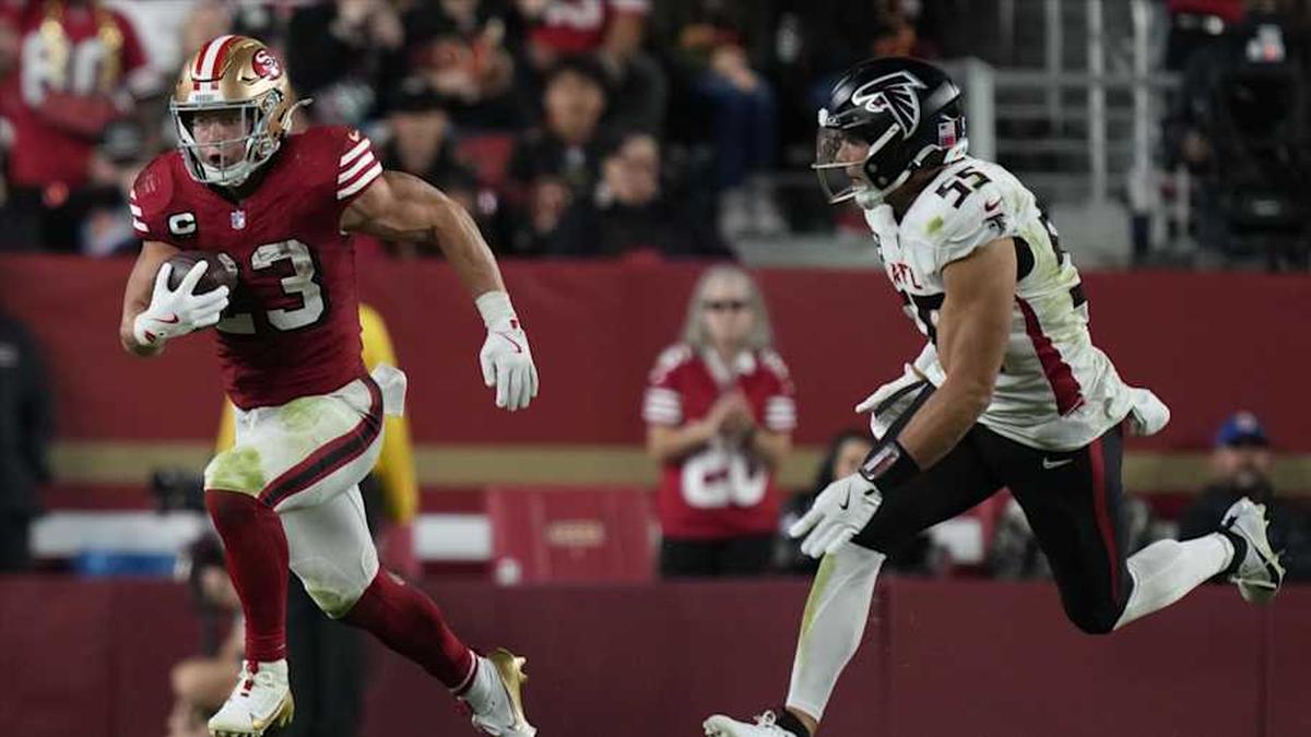 Oct 19, 2025; Santa Clara, California, USA; San Francisco 49ers running back Christian McCaffrey (23) runs the ball against Atlanta Falcons linebacker Kaden Elliss (55) during the fourth quarter at Levi's Stadium. Mandatory Credit: Kyle Terada-Imagn Images | Kyle Terada-Imagn Images 