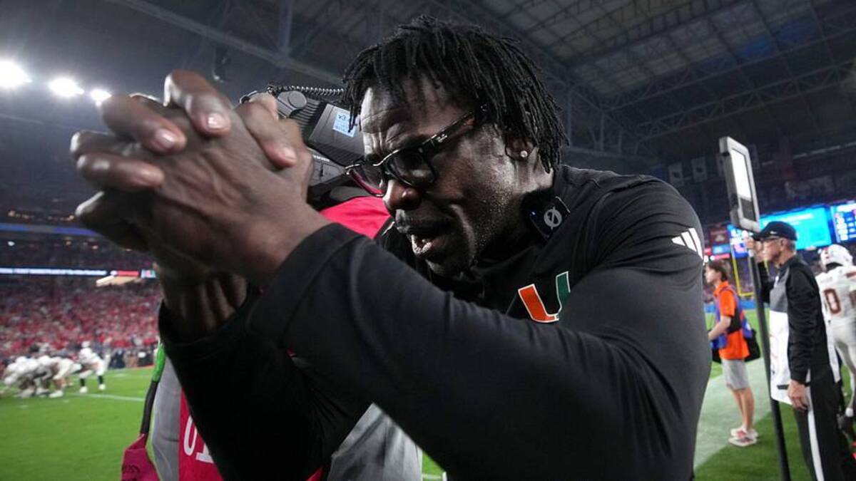 Michael Irvin reacts on the sidelines after the Miami Hurricanes score the winning touchdown against the Ole Miss Rebels during their Vrbo Fiesta Bowl matchup at State Farm Stadium on Jan. 8, 2026.