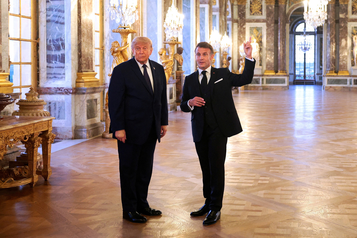 FILE PHOTO: U.S. President Donald Trump receives a tour of Chateau de Versailles from President of France Emmanuel Macron ahead of a dinner, France, June 17, 2026. Anna Moneymaker/Pool via REUTERS/File Photo