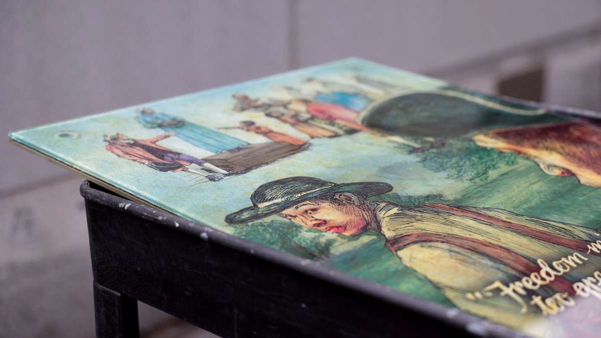 A painting for a slavery exhibit is being installed by workers from the National Park Service at a historic site in Philadelphia, following a judge's order on February 19, 2026.