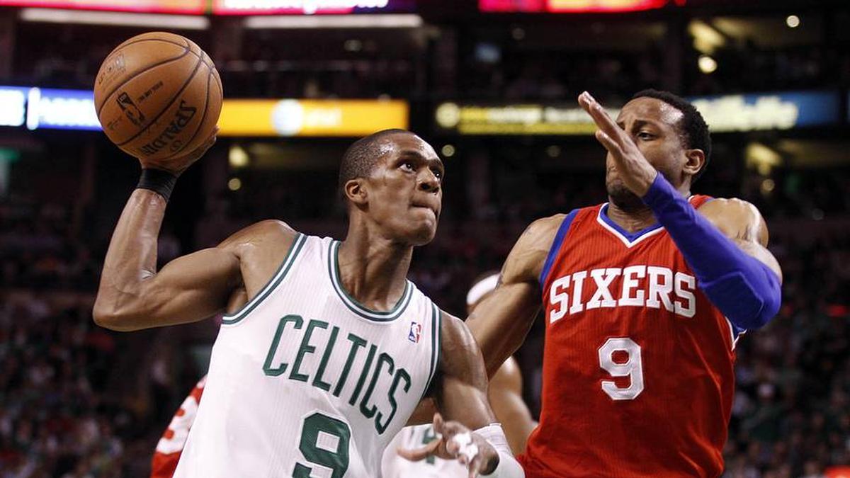  Celtics point guard Rajon Rondo drives to the basket while guarded by 76ers small forward Andre Iguodala. | David Butler II-Imagn Images 