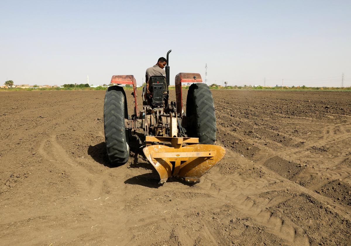 A tractor is used to plow the land at an agricultural project in South Omdurman, Sudan May, 21, 2026. REUTERS/El Tayeb Siddig