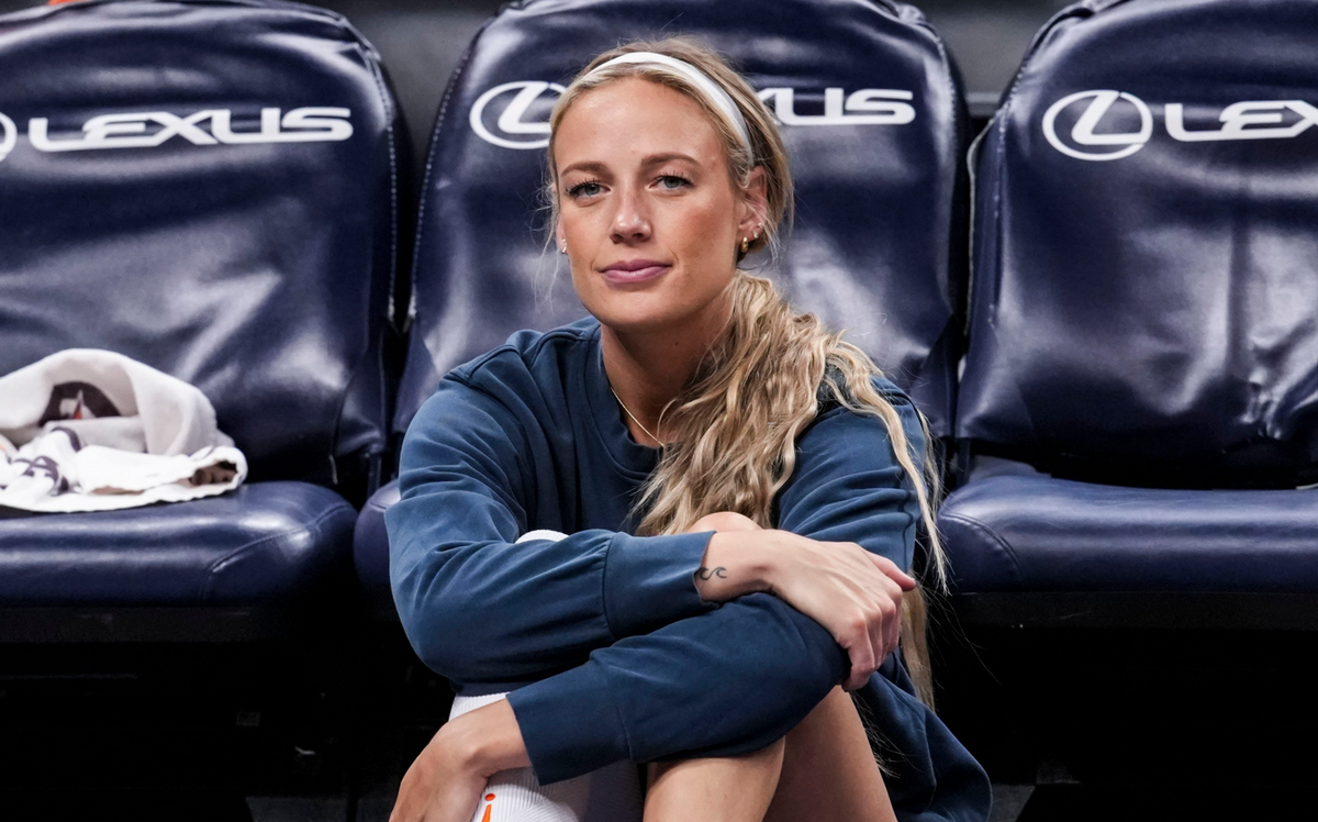  Indiana Fever guard Sophie Cunningham (8) sits on the sideline. © Grace Smith/IndyStar / USA TODAY NETWORK via Imagn Images