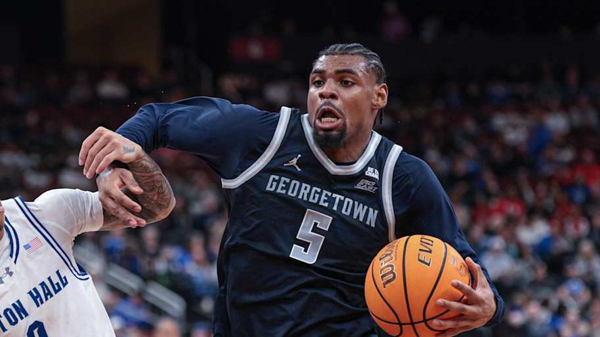  Feb 21, 2026; Newark, New Jersey, USA; Georgetown Hoyas guard KJ Lewis (5) drives to the basket against Seton Hall Pirates guard Adam Clark (0) during the first half at Prudential Center. Mandatory Credit: Vincent Carchietta-Imagn Images | Vincent Carchietta-Imagn Images 