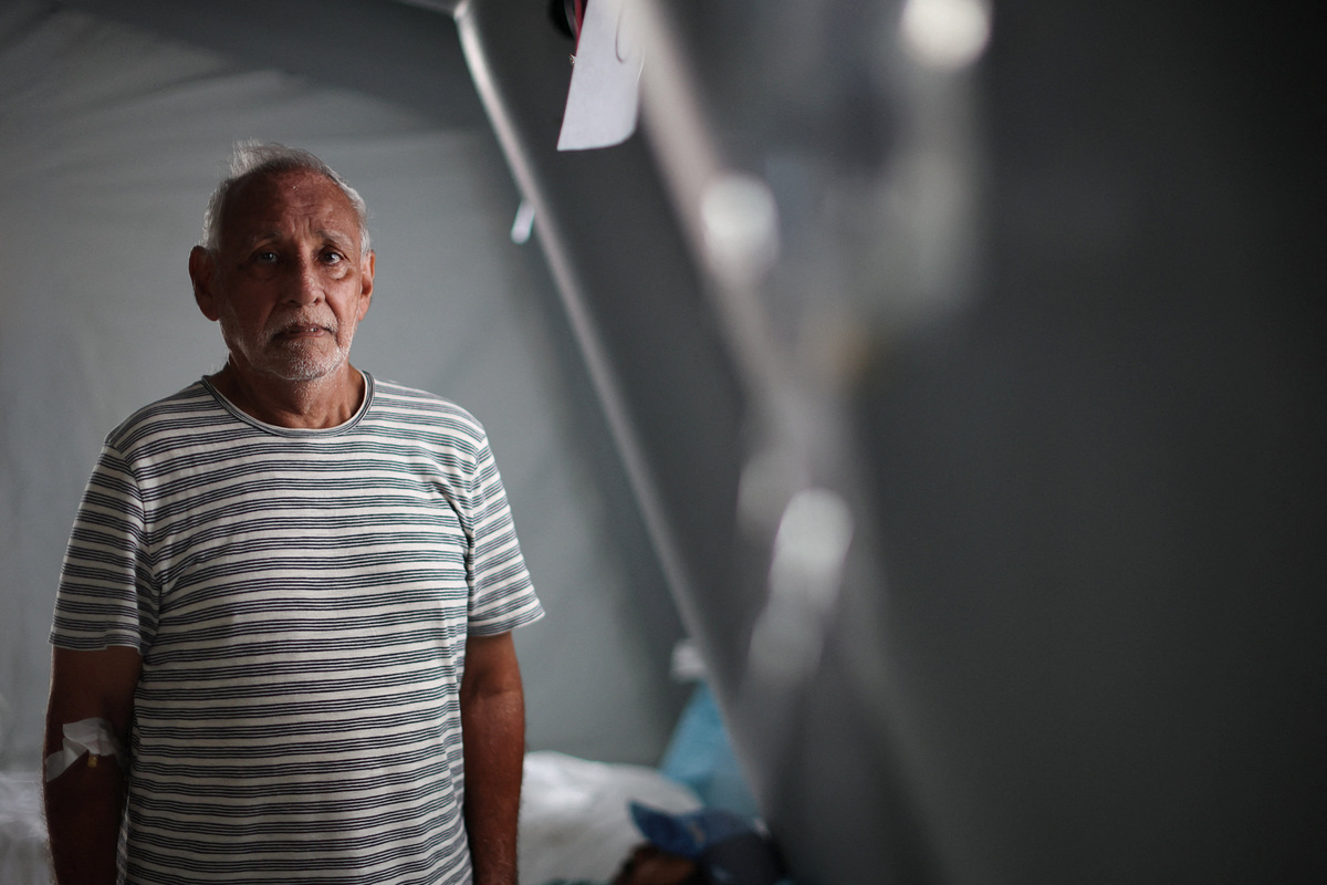 Juan Zapata poses for a photo, at a field hospital, which is part of the U.S. State Department's coordination, in the aftermath of the June 24 earthquakes, in La Guaira, Venezuela, July 4, 2026. REUTERS/Adriano Machado