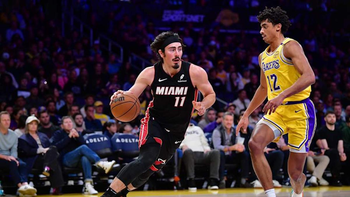  January 15, 2025; Los Angeles, California, USA; Miami Heat guard Jaime Jaquez Jr. (11) moves the ball against Los Angeles Lakers guard Max Christie (12) during the first half at Crypto.com Arena. Mandatory Credit: Gary A. Vasquez-Imagn Images | Gary A. Vasquez-Imagn Images 