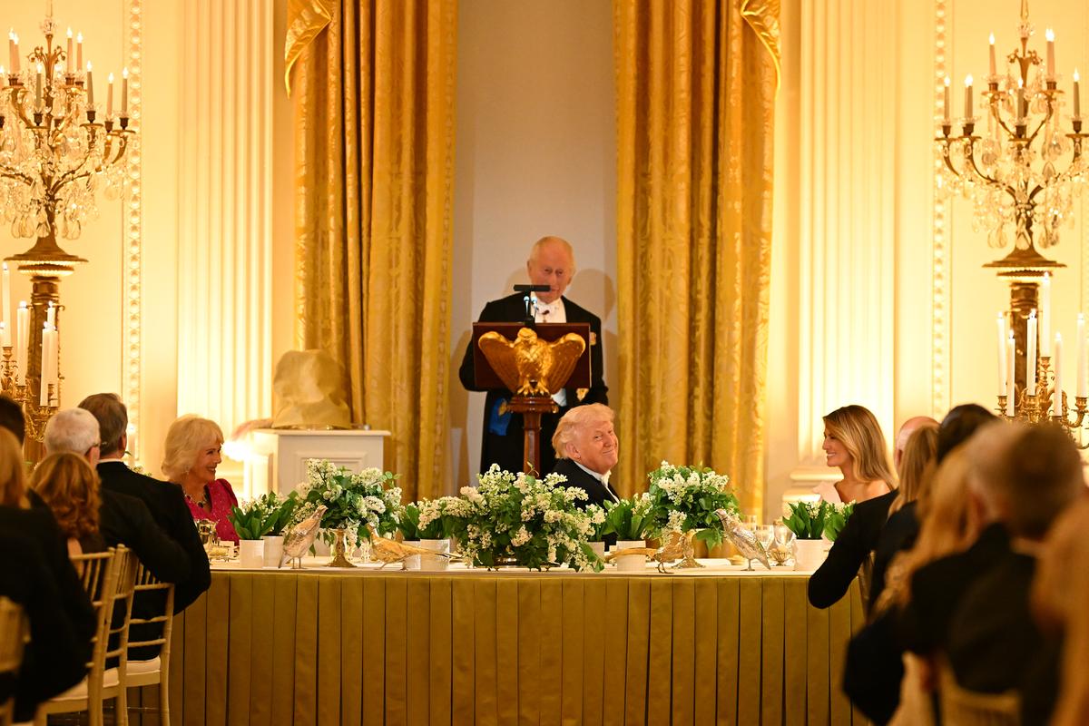 King Charles III of the United Kingdom speaks as, from left, Queen Camilla, President Donald Trump and first lady Melania Trump look on during a state dinner in the East Room of the White House in Washington, on Tuesday, April 28, 2026. (Kenny Holston/The New York Times)