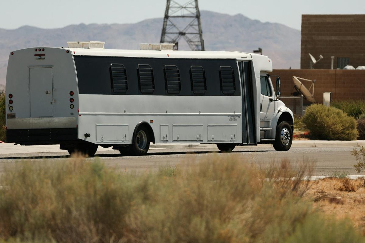 A shuttle bus transports detainees outside the private prison company GEO Group's ICE detention facility in Adelanto, Calif., on July 11, 2025. Patrick T. Fallon/AFP via Getty Images 