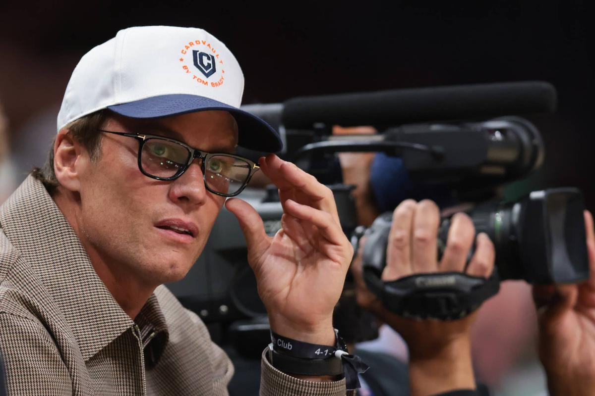  Tom Brady attends the game between the Miami Heat and the Boston Celtics. 