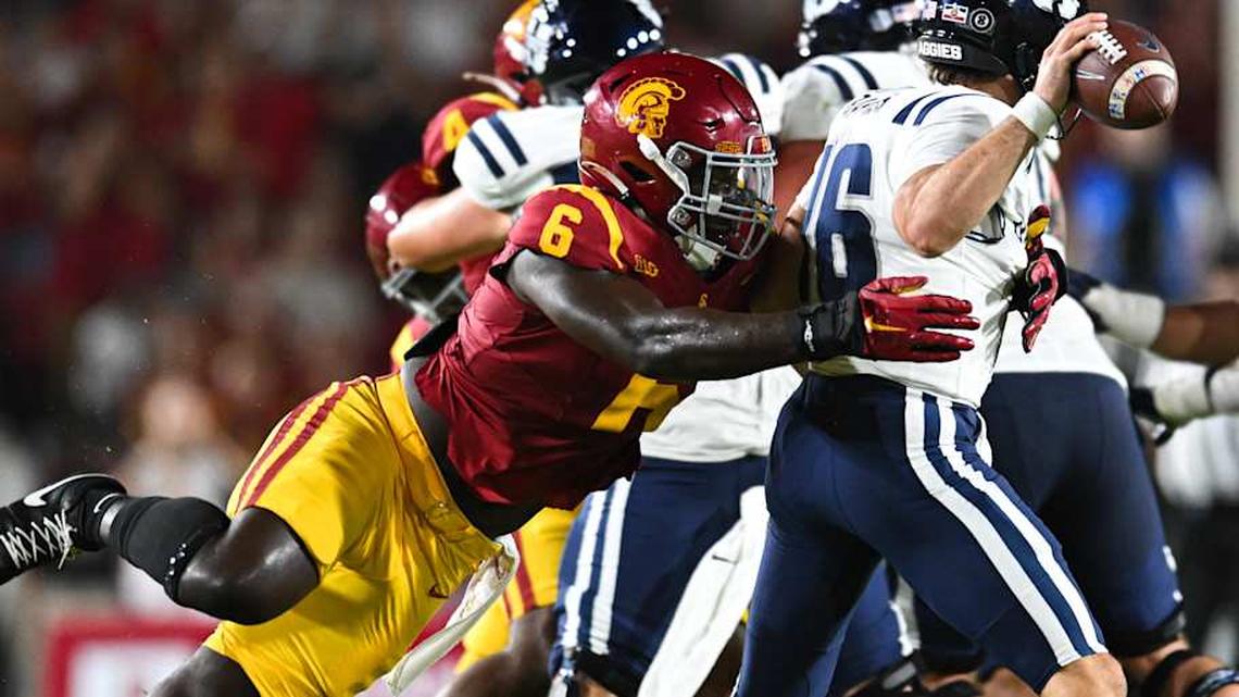  Sep 7, 2024; Los Angeles, California, USA; USC Trojans defensive end Anthony Lucas (6) attempts to sack Utah State Aggies quarterback Bryson Barnes (16) during the second quarter at United Airlines Field at Los Angeles Memorial Coliseum. Mandatory Credit: Jonathan Hui-Imagn Images | Jonathan Hui-Imagn Images 
