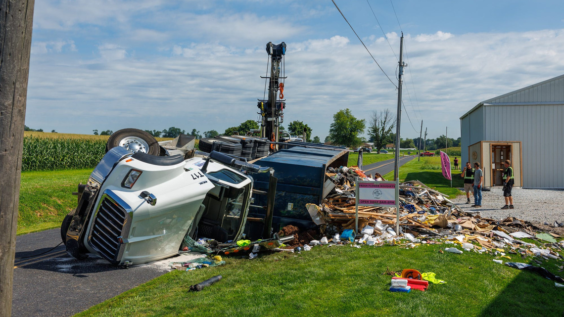Driver airlifted after rescue from overturned truck in Adams County