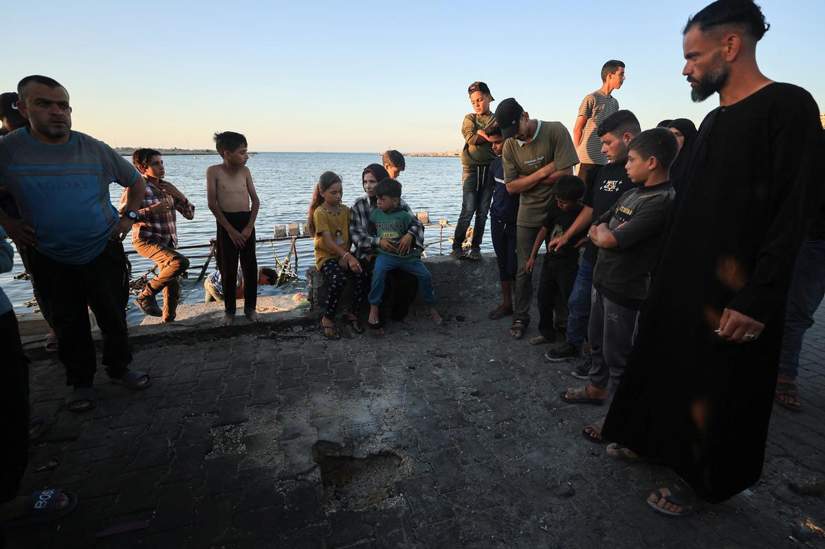 Palestinians gather at the site of an Israeli strike at a cafe at the seaport of Gaza City May 31, 2026. REUTERS/Dawoud Abu Alkas