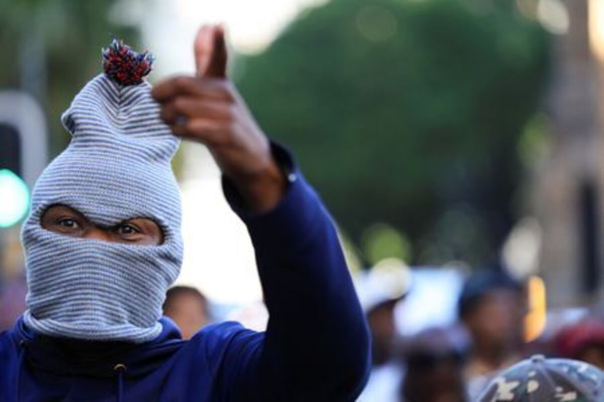A anti-immigrant protester gestures during a march on the day of an unofficial deadline set by anti-immigrant groups for all undocumented migrants to leave, in Cape Town, South Africa, June 30, 2026. REUTERS/Esa Alexander