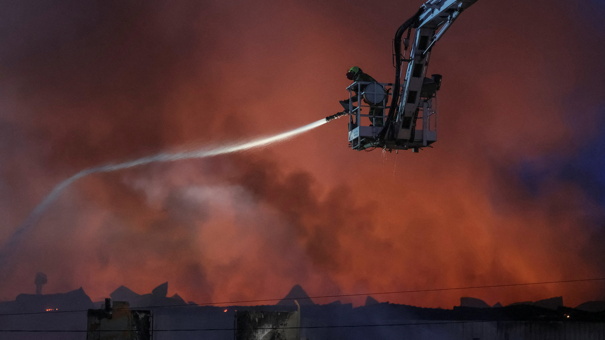 A firefighter works at the site of a Russian missile strike in Kyiv, Ukraine, on July 8. Ukraine and key Western allies on Monday announced an air-defense coalition that would include jointly developing a new anti-ballistic missile system to counter Russian ballistic missile attacks.