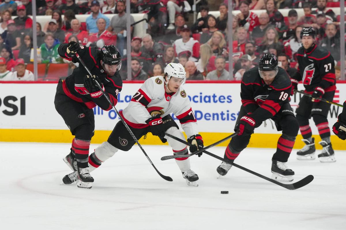  Carolina Hurricanes left wing Jordan Martinook (48) and defenseman K'andre Miller (19). James Guillory-Imagn Images