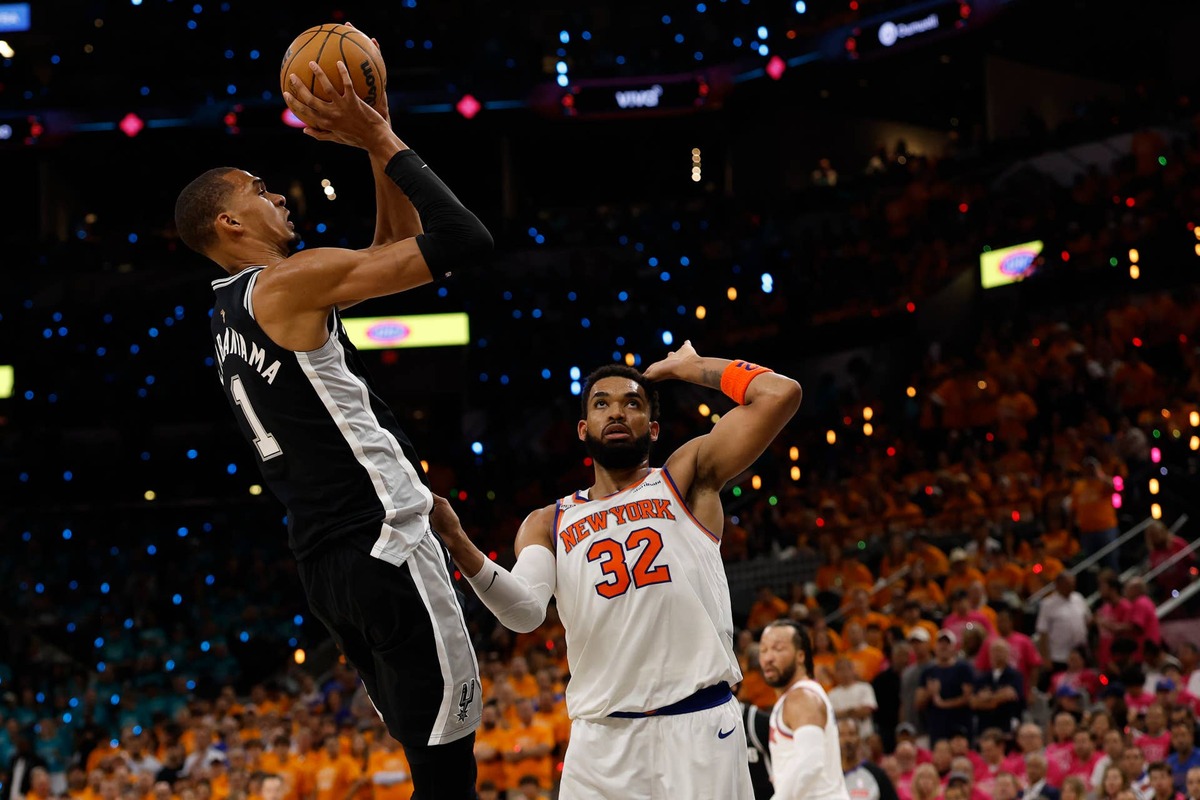  Jun 3, 2026; San Antonio, Texas, USA; San Antonio Spurs forward Victor Wembanyama (1) shoots the ball against New York Knicks center Karl-Anthony Towns (32) in the second half during game one of the 2026 NBA Finals at Frost Bank Center. Mandatory Credit: Geoff Burke-Imagn Images 
