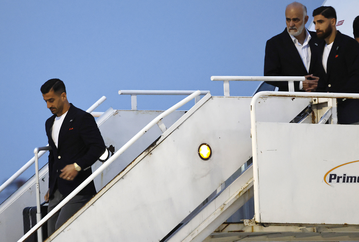  TIJUANA, MEXICO – JUNE 07: Members of the Iranian national soccer team including captain Ehsan Hajisafi (L) arrive at Tijuana International Airport on June 7, 2026 in Tijuana, Mexico. The team’s World Cup participation has been complicated by the Iran war, with the team now training in Tijuana, Mexico instead of Tucson, Arizona amid ongoing U.S. visa processing issues. Iran will play its first two games across the U.S. border in Southern California against New Zealand on June 15 and against Belgium on June 21. (Photo by Mario Tama/Getty Images) 